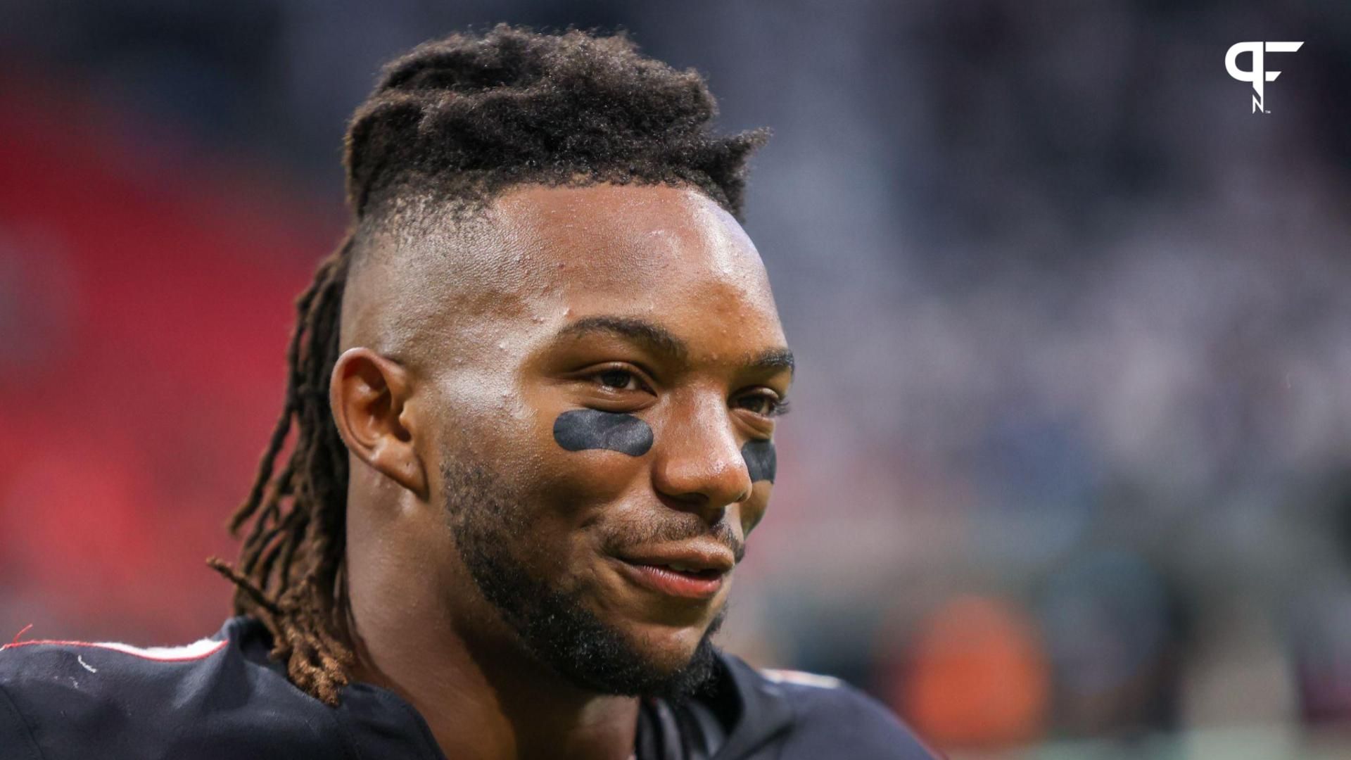 Atlanta Falcons running back Bijan Robinson (7) does an interview after a victory against the Carolina Panthers at Mercedes-Benz Stadium.