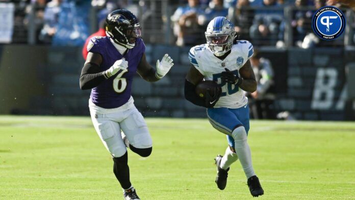 Lions running back Jahmyr Gibbs (26) rushes as Baltimore Ravens linebacker Patrick Queen (6) defends during the second half at M&T Bank Stadium.