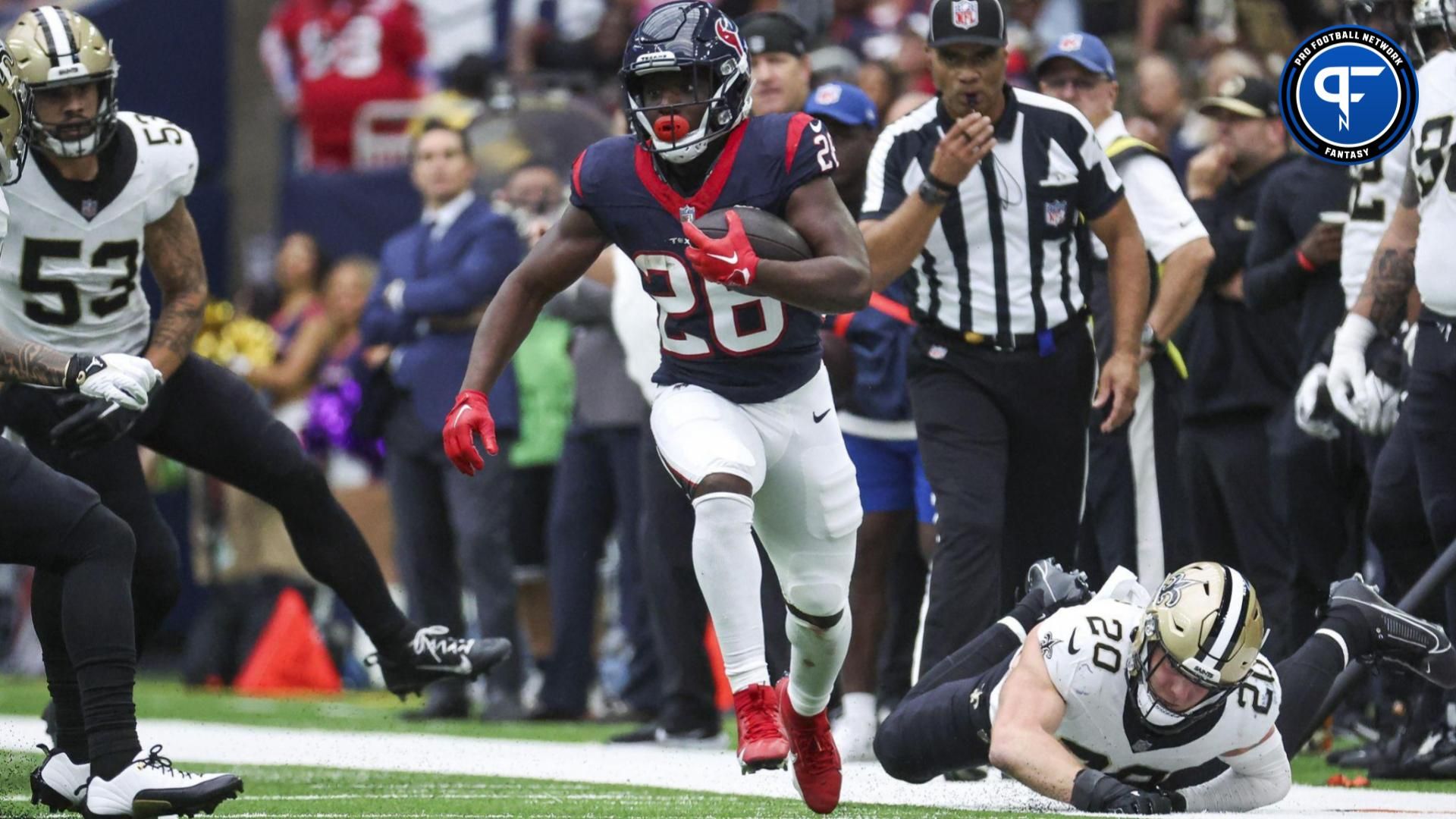 New Orleans Saints linebacker Pete Werner (20) is unable to make a tackle as Houston Texans running back Devin Singletary (26) runs with the ball at NRG Stadium.