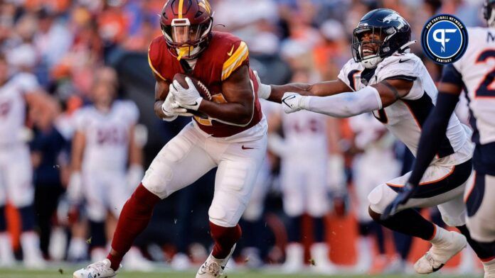 Washington Commanders RB Antonio Gibson (24) runs against the Denver Broncos.