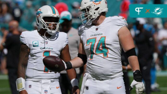 Miami Dolphins QB Tua Tagovailoa (1) and guard Liam Eichenberg (74) talk before the game.