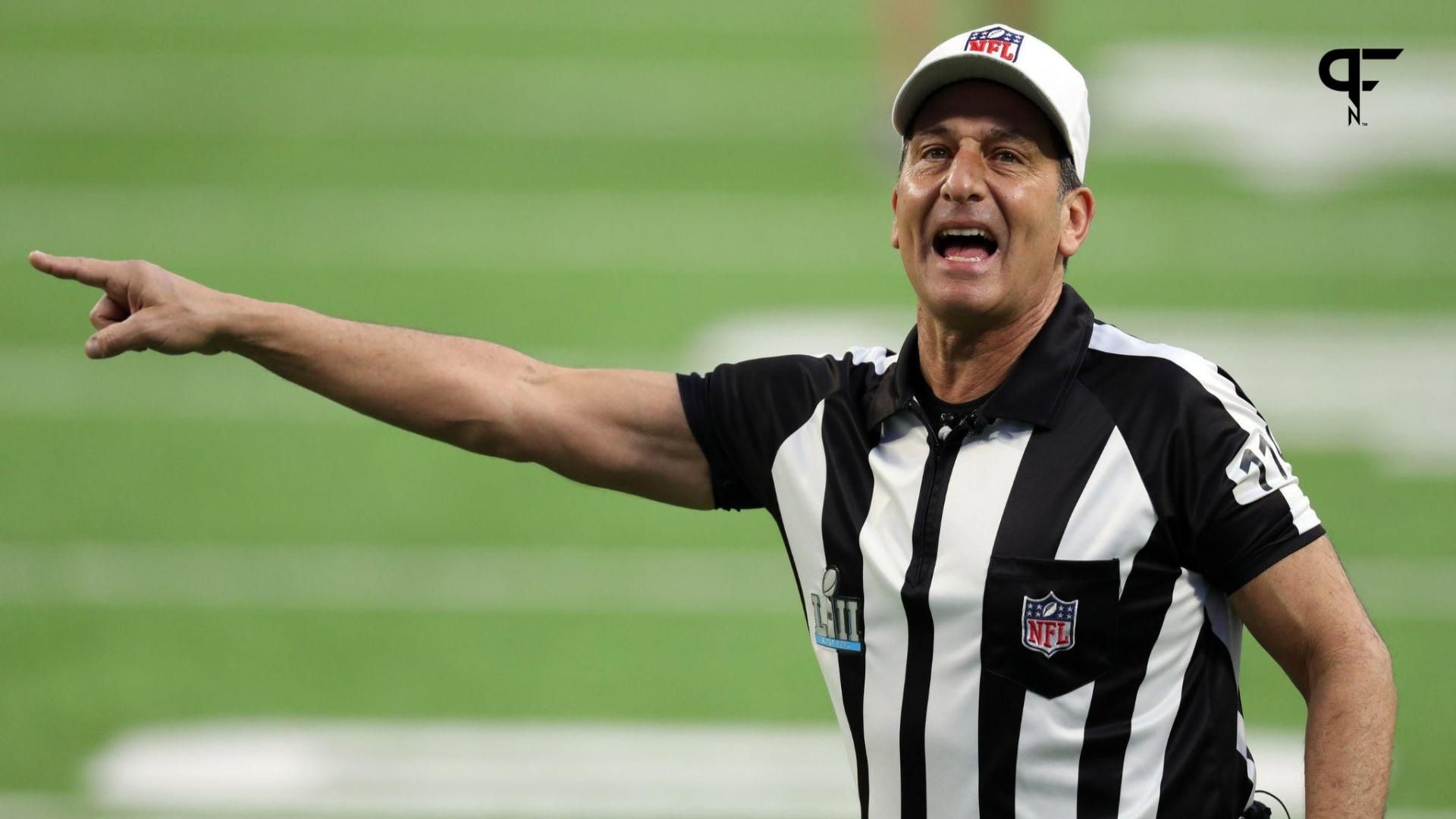 Referee Gene Steratore (114) points prior to Super Bowl LII between the New England Patriots and the Philadelphia Eagles at U.S. Bank Stadium.