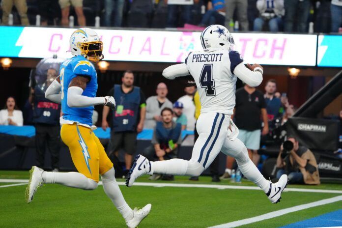 Dallas Cowboys QB Dak Prescott (4) runs into the end zone against the Los Angeles Chargers.