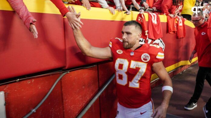 Travis Kelce (87) leaves the field after the win over the Los Angeles Chargers at GEHA Field at Arrowhead Stadium.