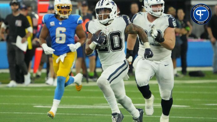 Tony Pollard (20) carries the ball on a 60-yard reception in the second half against the Los Angeles Chargers at SoFi Stadium.