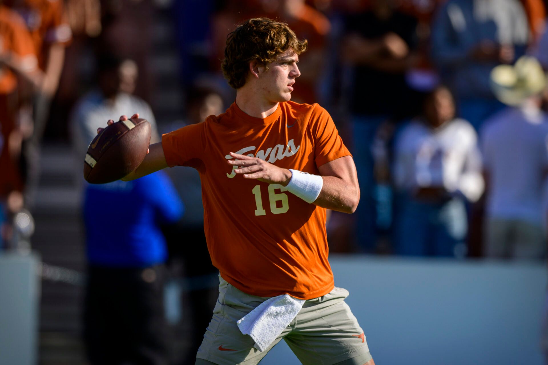 Texas Longhorns quarterback Arch Manning (16) warms up before the game between the Texas Longhorns and the Oklahoma Sooners at the Cotton Bowl.