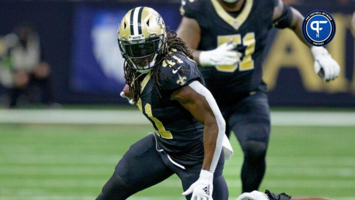 Alvin Kamara (41) runs against Jacksonville Jaguars linebacker Travon Walker (44) during the second quarter at the Caesars Superdome.