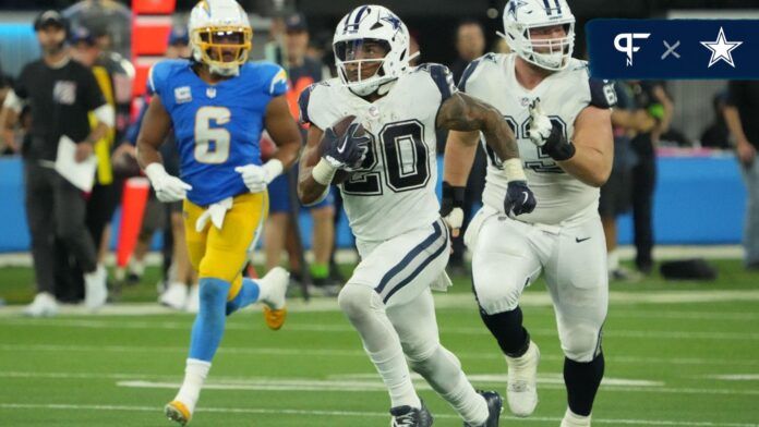 Dallas Cowboys running back Tony Pollard (20) carries the ball on a 60-yard reception in the second half against the Los Angeles Chargers at SoFi Stadium.