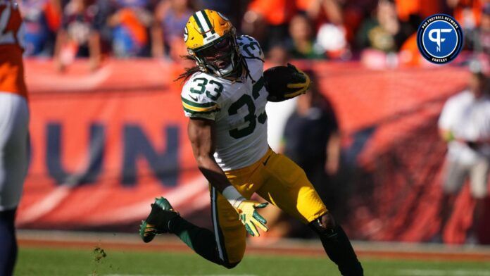 Green Bay Packers running back Aaron Jones (33) carries the ball in the second quarter against the Denver Broncos at Empower Field at Mile High.