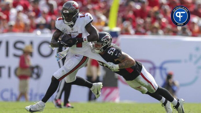 Tampa Bay Buccaneers wide receiver Chris Godwin (14) is tackled by Atlanta Falcons linebacker Nate Landman (53) at Raymond James Stadium.