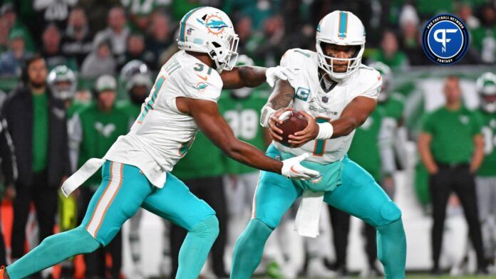 Miami Dolphins quarterback Tua Tagovailoa (1) hands the ball off to running back Raheem Mostert (31) against the Philadelphia Eagles at Lincoln Financial Field.