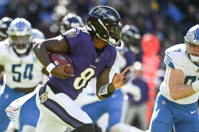 Baltimore Ravens QB Lamar Jackson (8) runs with the ball against the Detroit Lions.