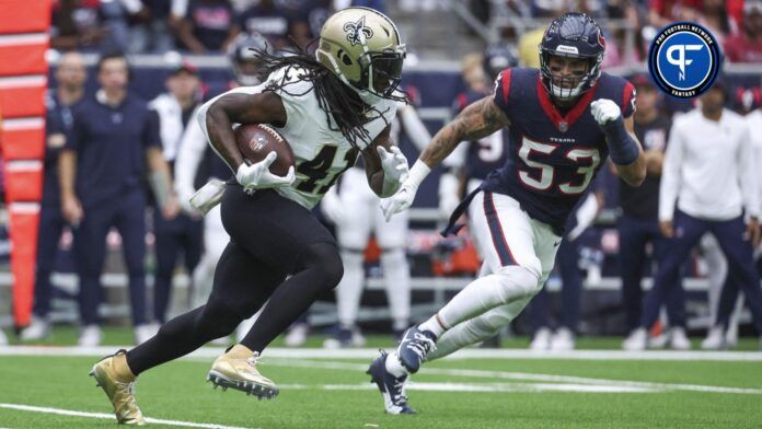 New Orleans Saints running back Alvin Kamara (41) runs with the ball as Houston Texans linebacker Blake Cashman (53) attempts to make a tackle during the first quarter at NRG Stadium.