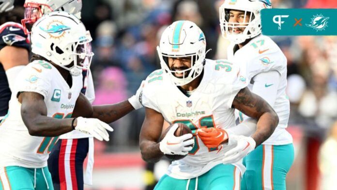 Miami Dolphins WR Tyreek Hill and RB Raheem Mostert (31) celebrate a touchdown.