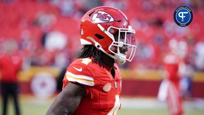 Kansas City Chiefs wide receiver Rashee Rice (4) runs onto the field for warm ups against the Denver Broncos prior to a game at GEHA Field at Arrowhead Stadium.