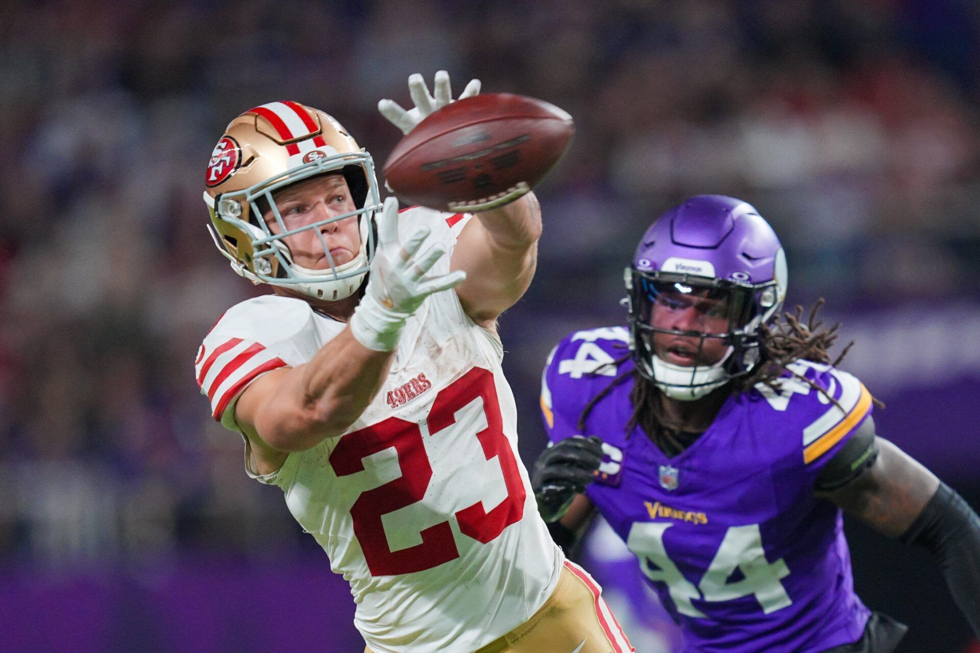 San Francisco 49ers RB Christian McCaffrey (23) catches a pass against the Minnesota Vikings.