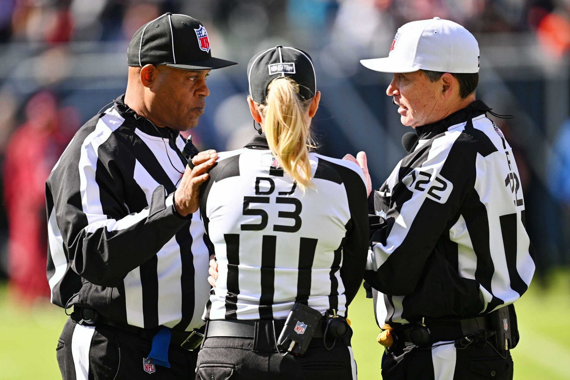 NFL referee Brad Allen (122) talks with down judge Sarah Thomas (53) and side judge Boris Cheek (41) during a NFL game between the Minnesota Vikings and the Chicago Bears at Soldier Field.