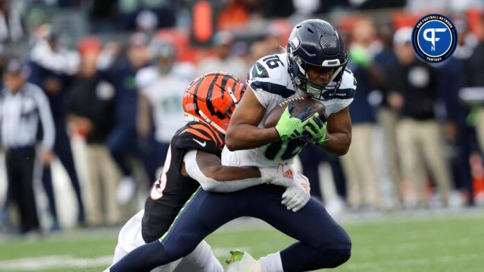 Seattle Seahawks wide receiver Tyler Lockett (16) makes the catch as Cincinnati Bengals safety Nick Scott (33) defends during the fourth quarter at Paycor Stadium.