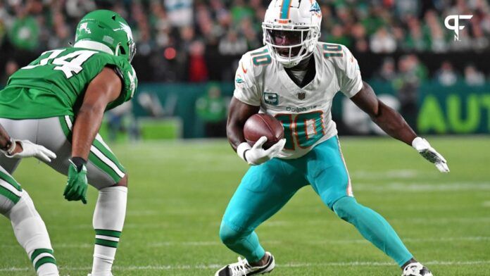 Miami Dolphins WR Tyreek Hill (10) tries to make a move against the Philadelphia Eagles defense.