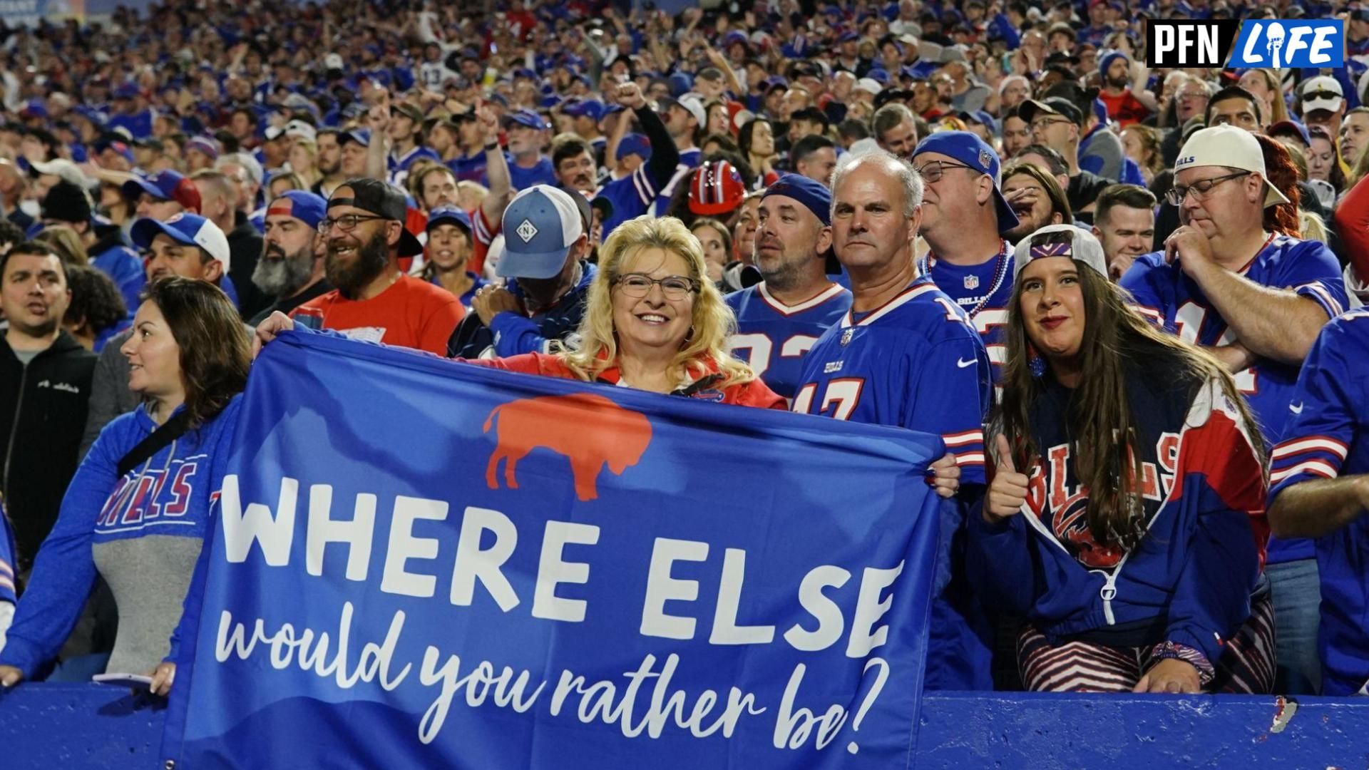 A Buffalo Bills fan holds a banner during the second half \t\w at Highmark Stadium.