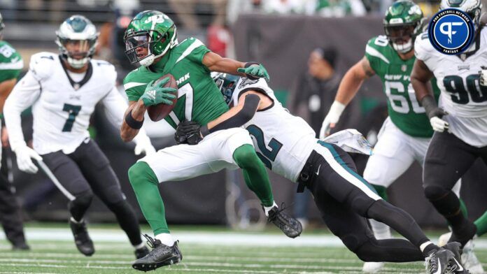 New York Jets wide receiver Garrett Wilson (17) is tackled by Philadelphia Eagles safety Reed Blankenship (32).