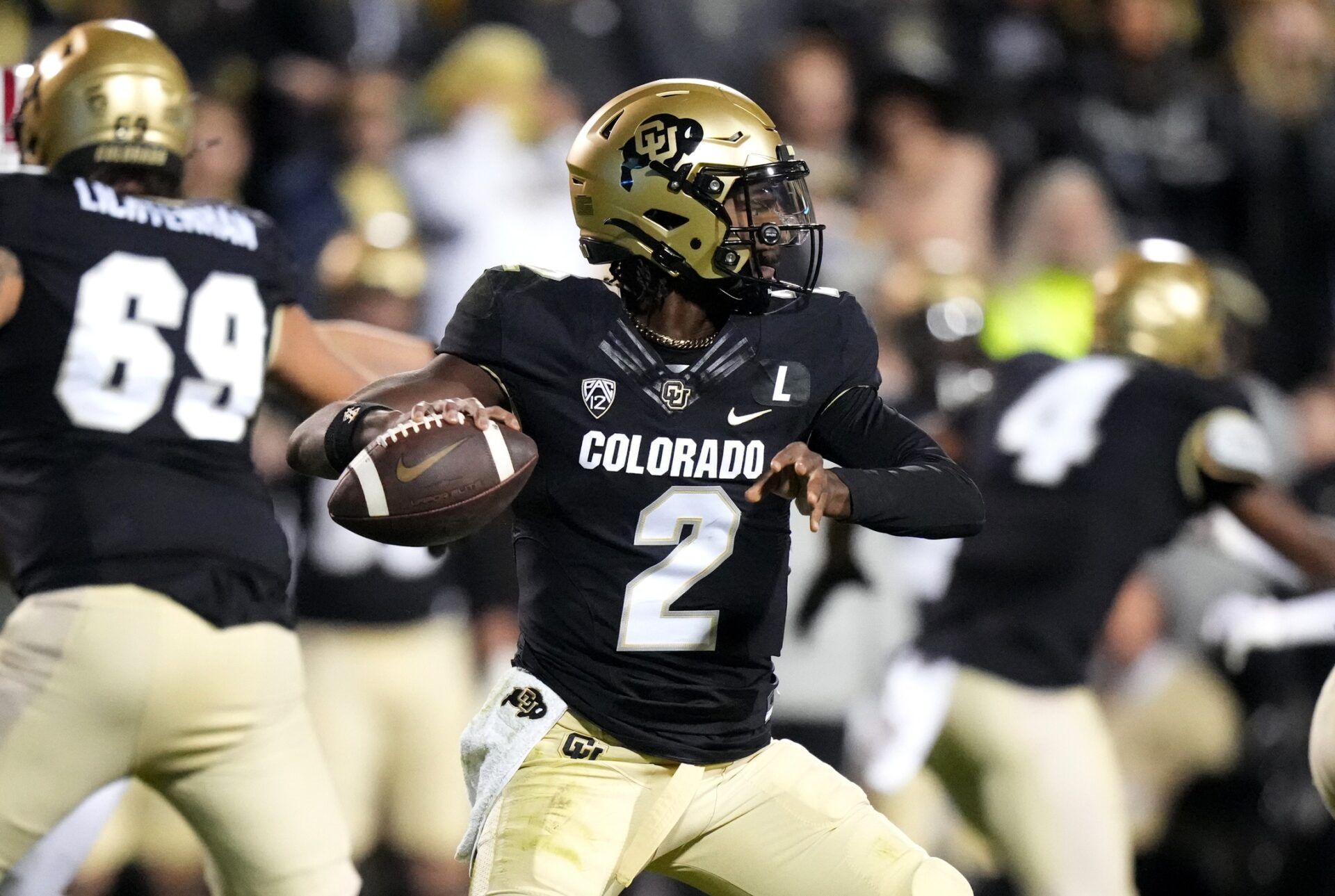 Colorado Buffaloes QB Shedeur Sanders (2) prepares to make a pass.