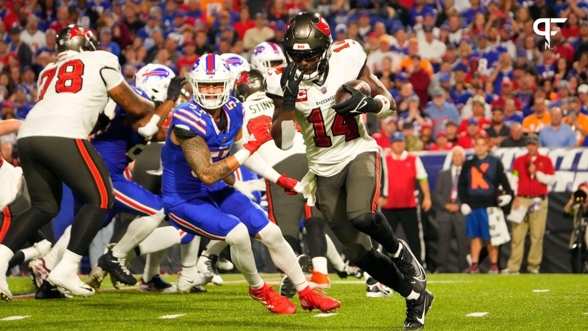 Tampa Bay Buccaneers wide receiver Chris Godwin (14) runs with the ball against the Buffalo Bills during the first half at Highmark Stadium.