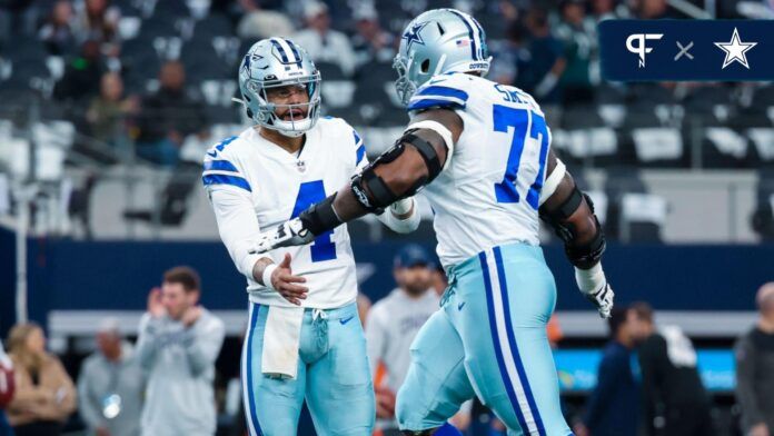 Dallas Cowboys quarterback Dak Prescott (4) greets offensive tackle Tyron Smith (77) before the game against the Philadelphia Eagles at AT&T Stadium.