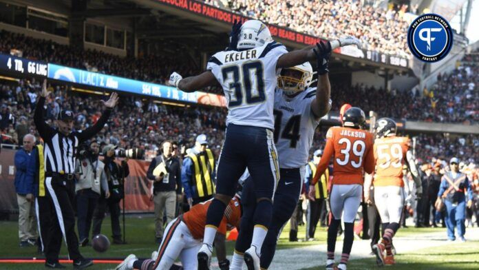 Los Angeles Chargers running back Austin Ekeler (30) celebrates his touchdown against the Chicago Bears with fullback Derek Watt (34) during the second half at Soldier Field.