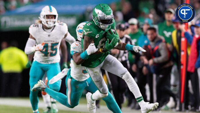 Philadelphia Eagles wide receiver DeVonta Smith (6) runs with the ball after a catch in front of Miami Dolphins cornerback Eli Apple (33) during the third quarter at Lincoln Financial Field.