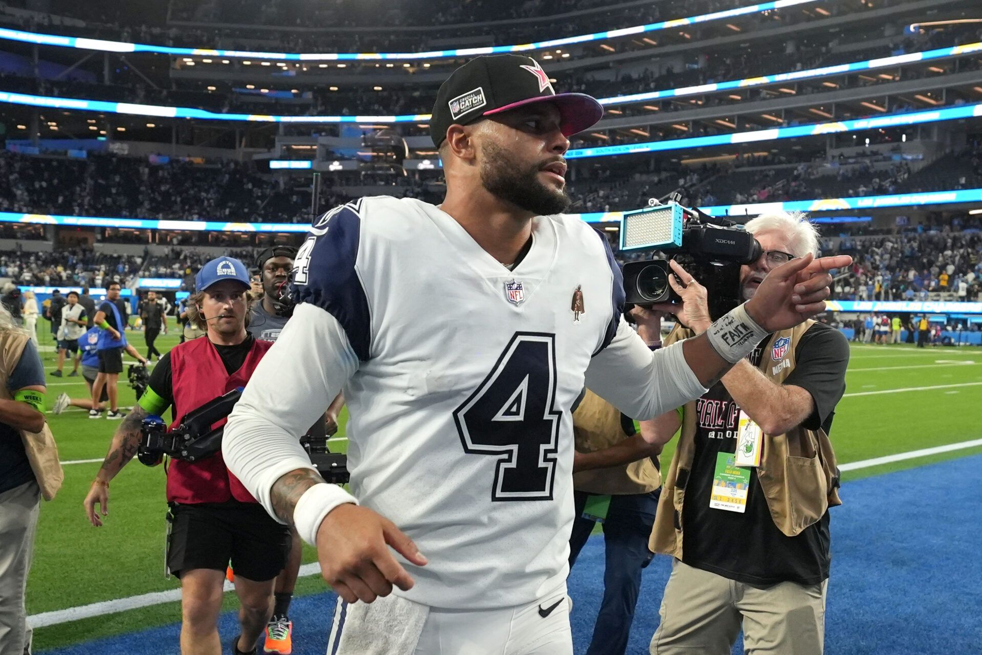 Dallas Cowboys quarterback Dak Prescott (4) leaves the field after the game against the Los Angeles Chargers at SoFi Stadium.
