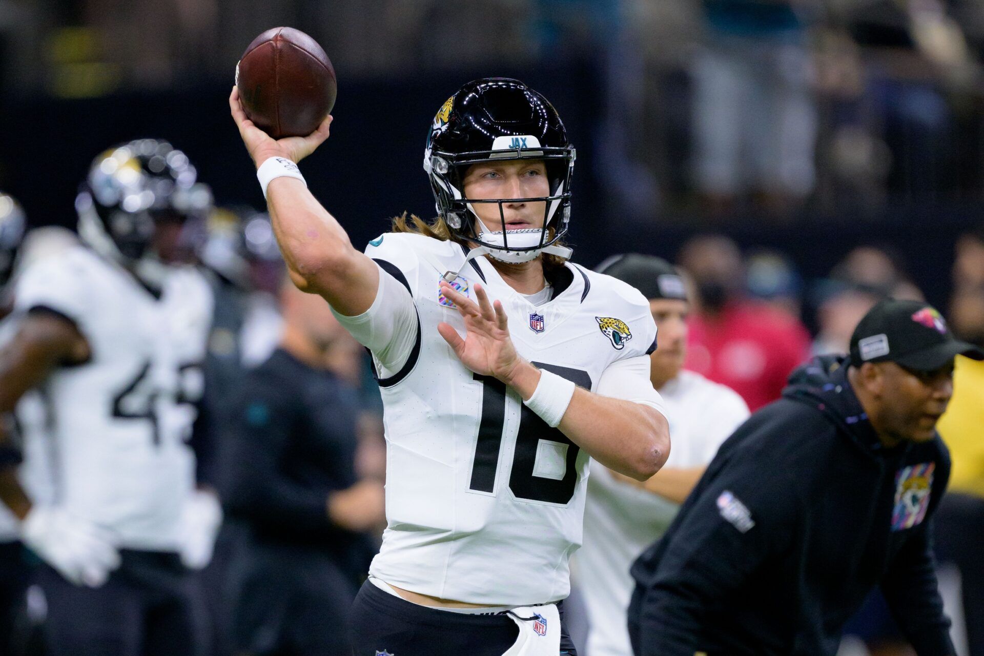 Trevor Lawrence (16) warms up before a game against the New Orleans Saints at the Caesars Superdome.