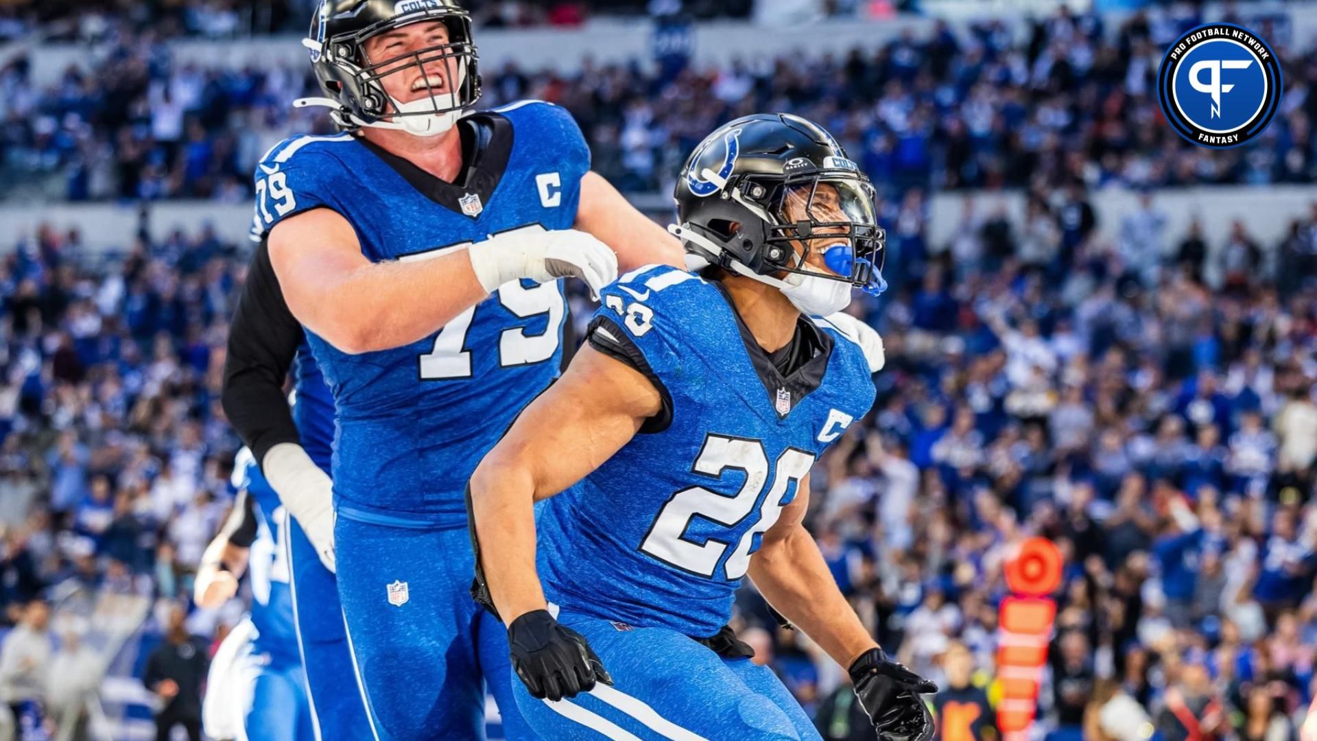 Jonathan Taylor (28) celebrates his touchdown with teammates in the second half against the Cleveland Browns at Lucas Oil Stadium.