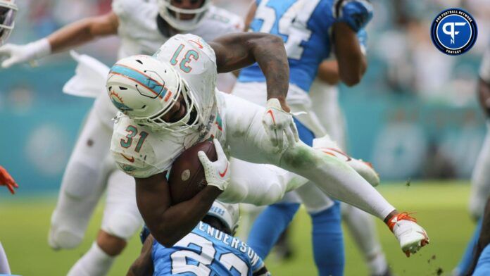 Raheem Mostert (31) goes over Carolina Panthers cornerback CJ Henderson (23) during the fourth quarter at Hard Rock Stadium.