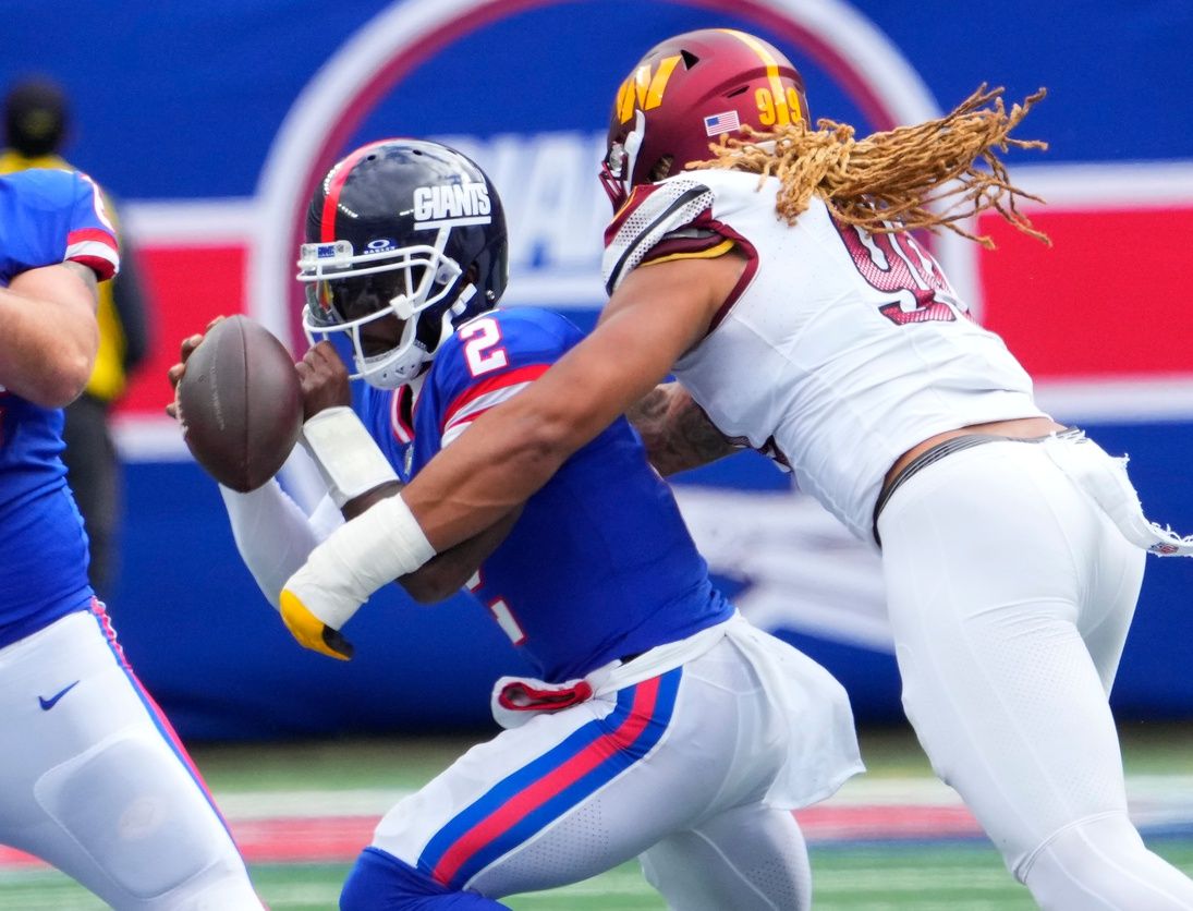 Chase Young (99) sacks New York Giants quarterback Tyrod Taylor (2) in the first half at MetLife Stadium.