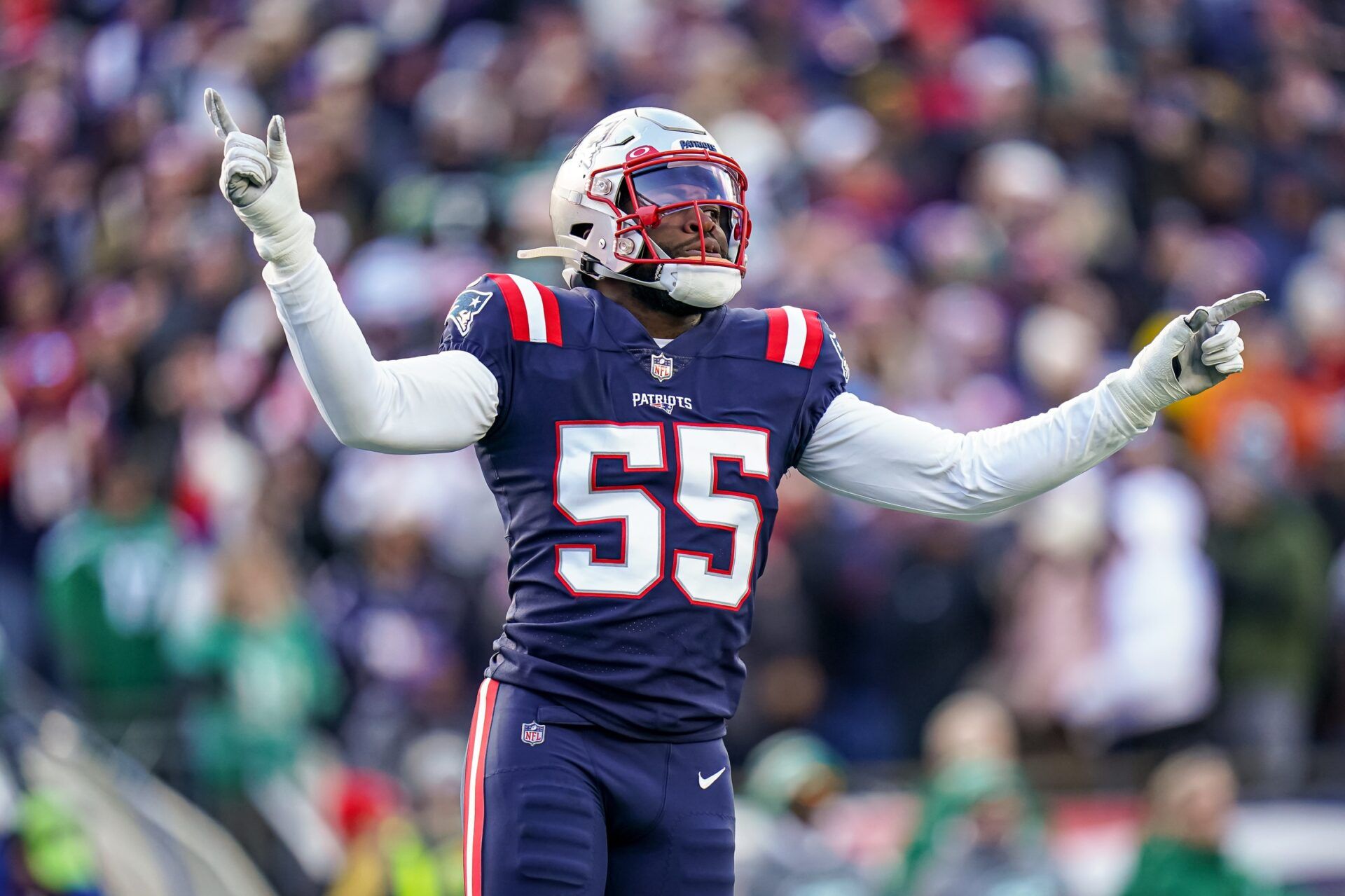 New England Patriots linebacker Josh Uche (55) react on the field after a play against the New York Jets in the first half at Gillette Stadium.