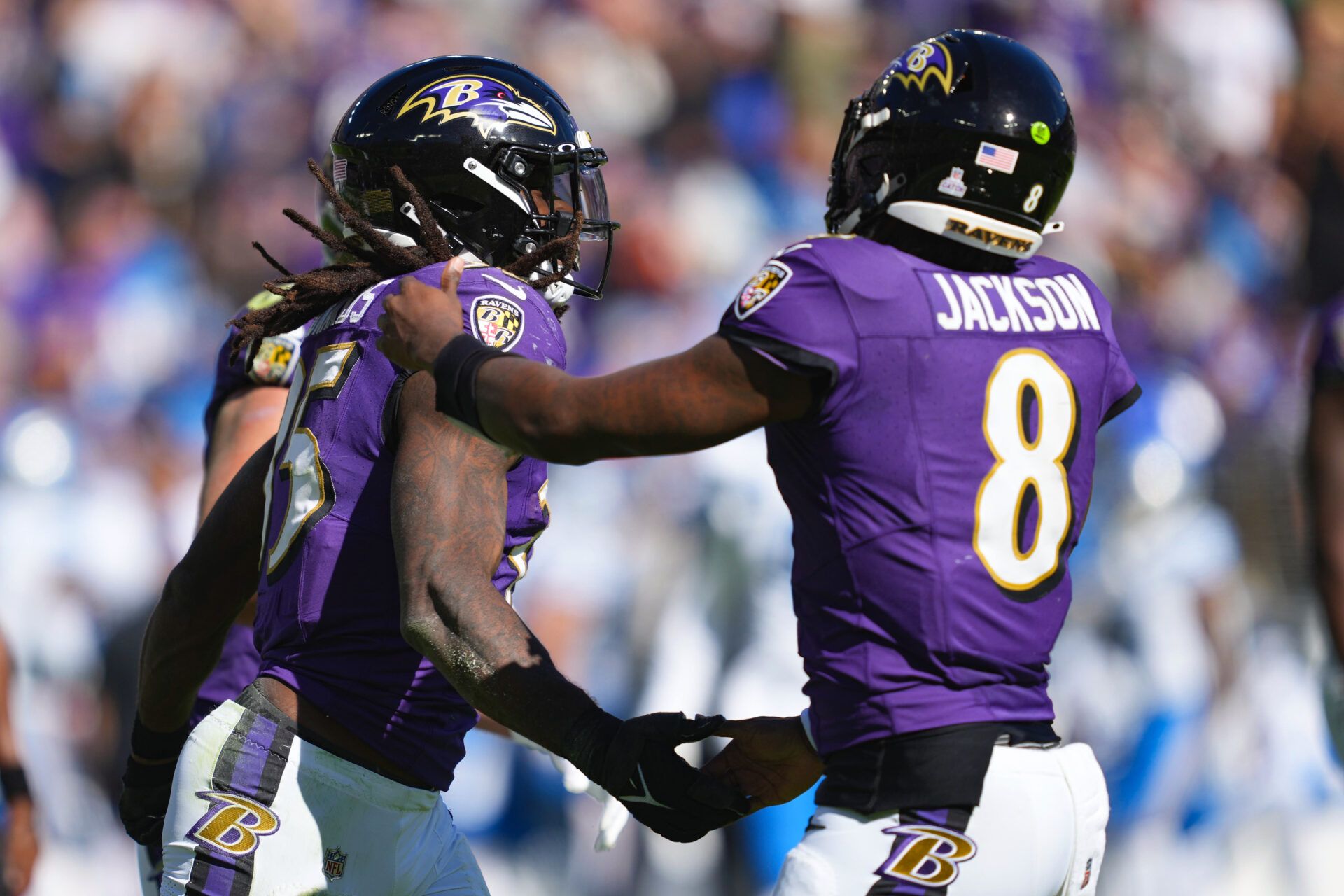 Baltimore Ravens running back Gus Edwards (35) celebrates his touchdown with quarterback Lamar Jackson (8) during the second quarter against the Detroit Lions at M&T Bank Stadium.