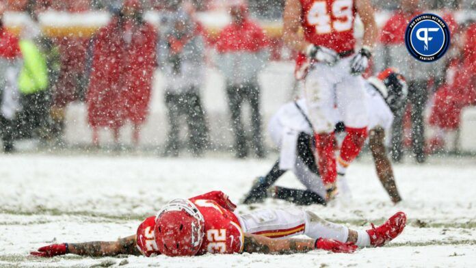 Kansas City Chiefs strong safety Tyrann Mathieu (32) makes a snow angel after a play against the Denver Broncos during the second half at Arrowhead Stadium.