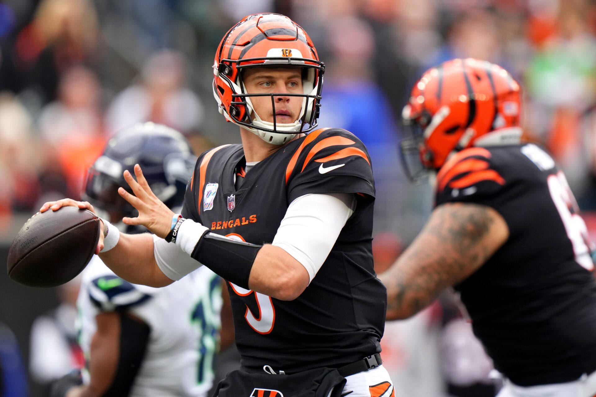 Cincinnati Bengals quarterback Joe Burrow (9) throws in the fourth quarter during an NFL football game between the Seattle Seahawks and the Cincinnati Bengals Sunday, Oct. 15, 2023, at Paycor Stadium in Cincinnati.