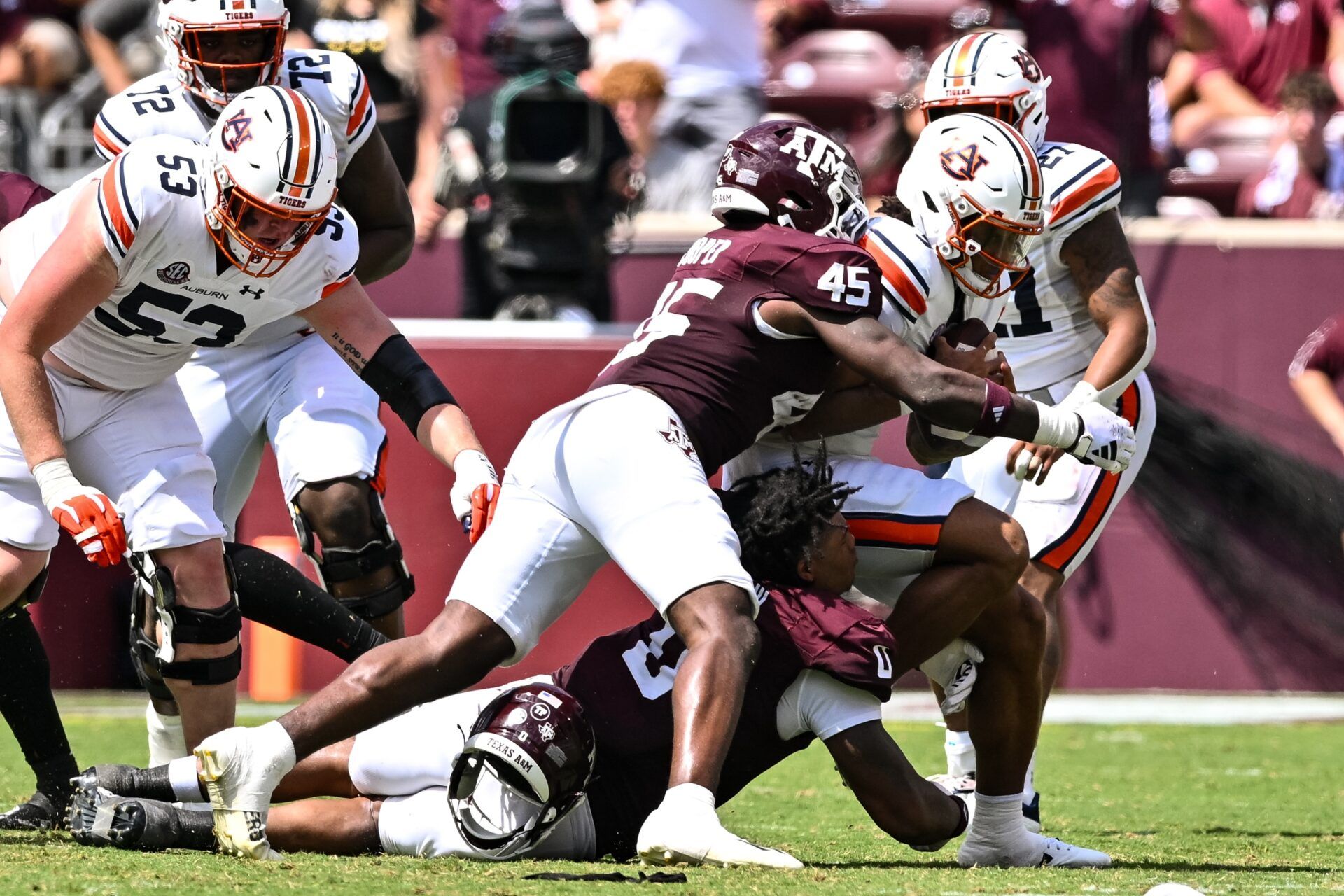 Edgerrin Cooper (45) tackles Auburn Tigers quarterback Robby Ashford (9) for a loss during the third quarter at Kyle Field.