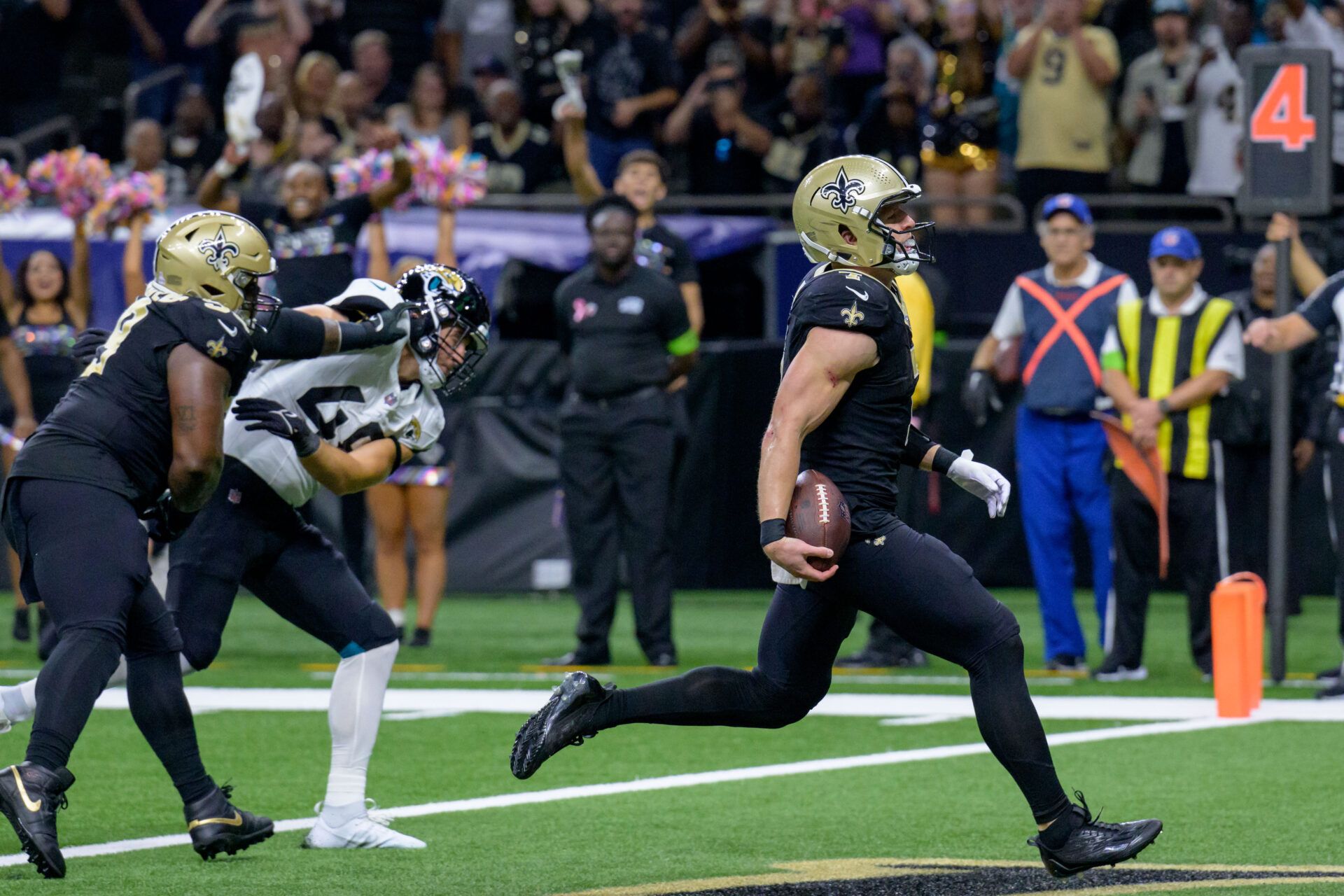 New Orleans Saints quarterback Taysom Hill (7) scores a touchdown against the Jacksonville Jaguars during the fourth quarter at the Caesars Superdome.