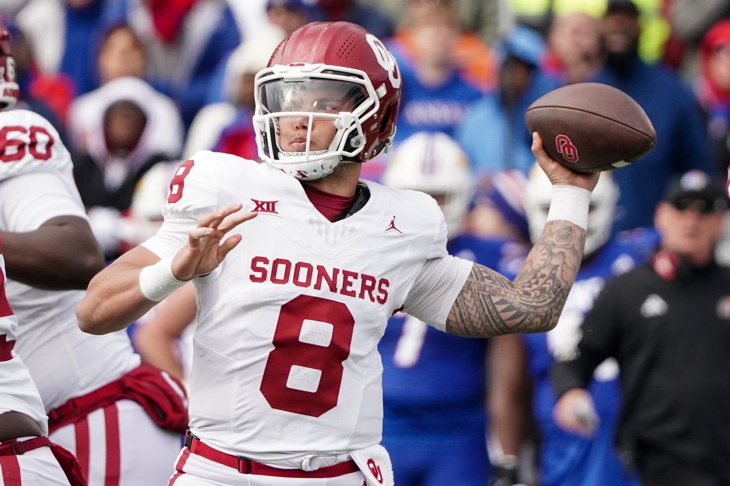 Dillon Gabriel (8) throws a pass against the Kansas Jayhawks during the first half at David Booth Kansas Memorial Stadium.