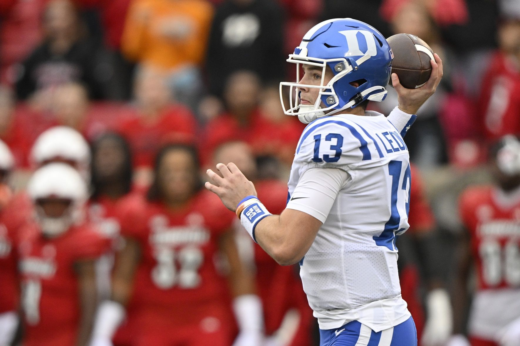 Riley Leonard (13) looks to pass against the Louisville Cardinals during the first quarter at L&N Federal Credit Union Stadium.