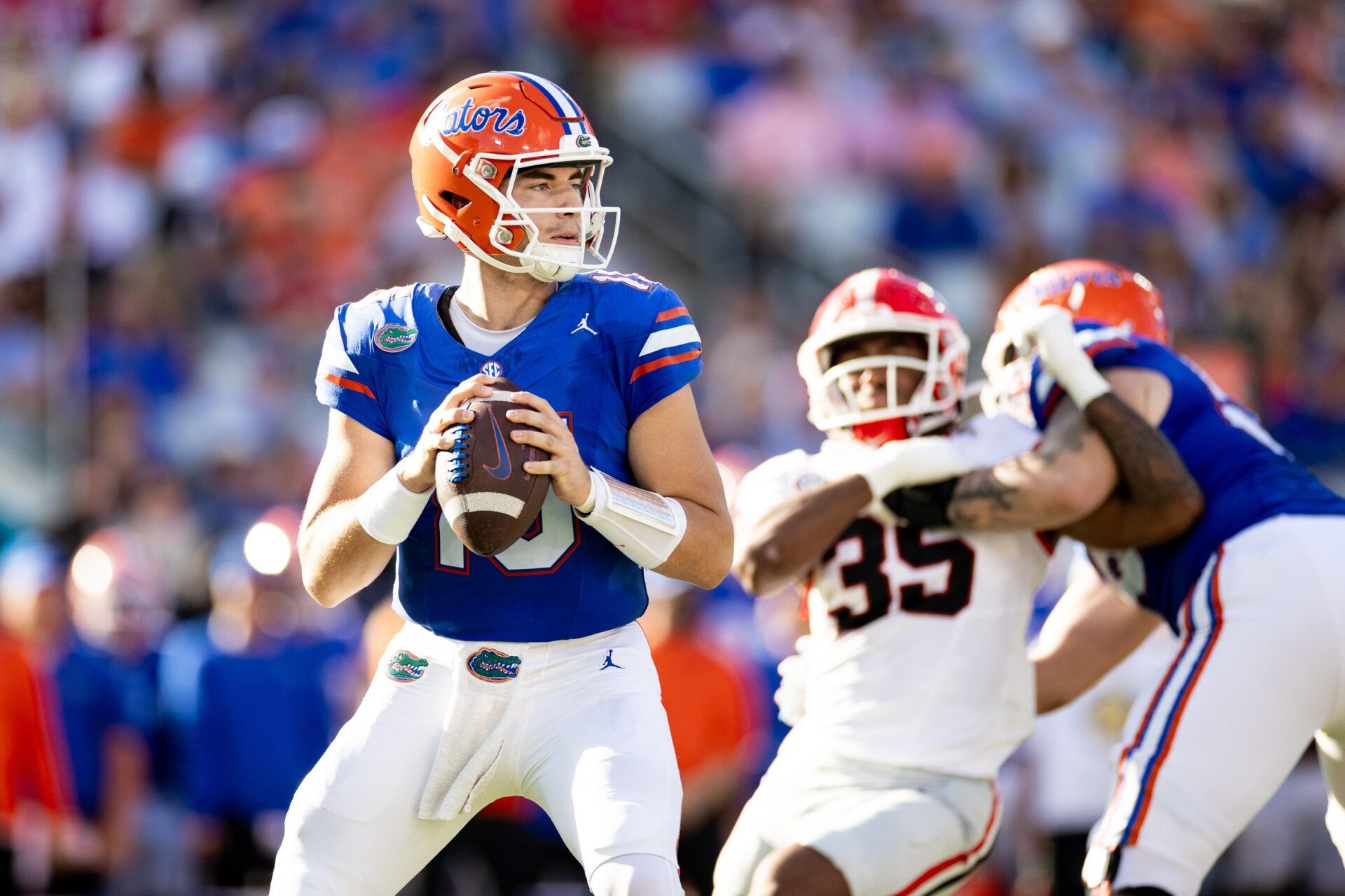 Graham Mertz (15) looks to throw during the first half against the Georgia Bulldogs at Everbank Stadium.