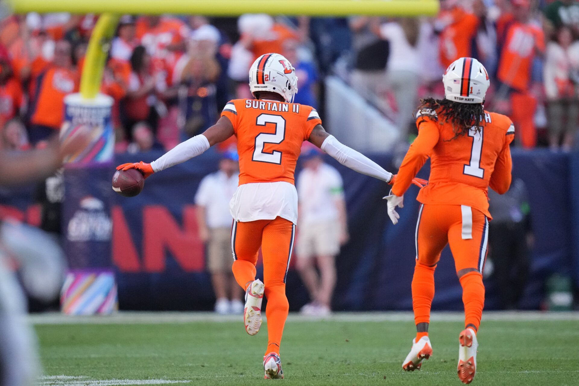 Pat Surtain II (2) celebrates his interception with cornerback Tremon Smith (1) in the second half against the New York Jets at Empower Field at Mile High.