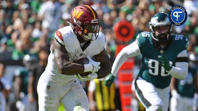 Brian Robinson Jr. (8) runs with the football against the Philadelphia Eagles during the first quarter at Lincoln Financial Field.