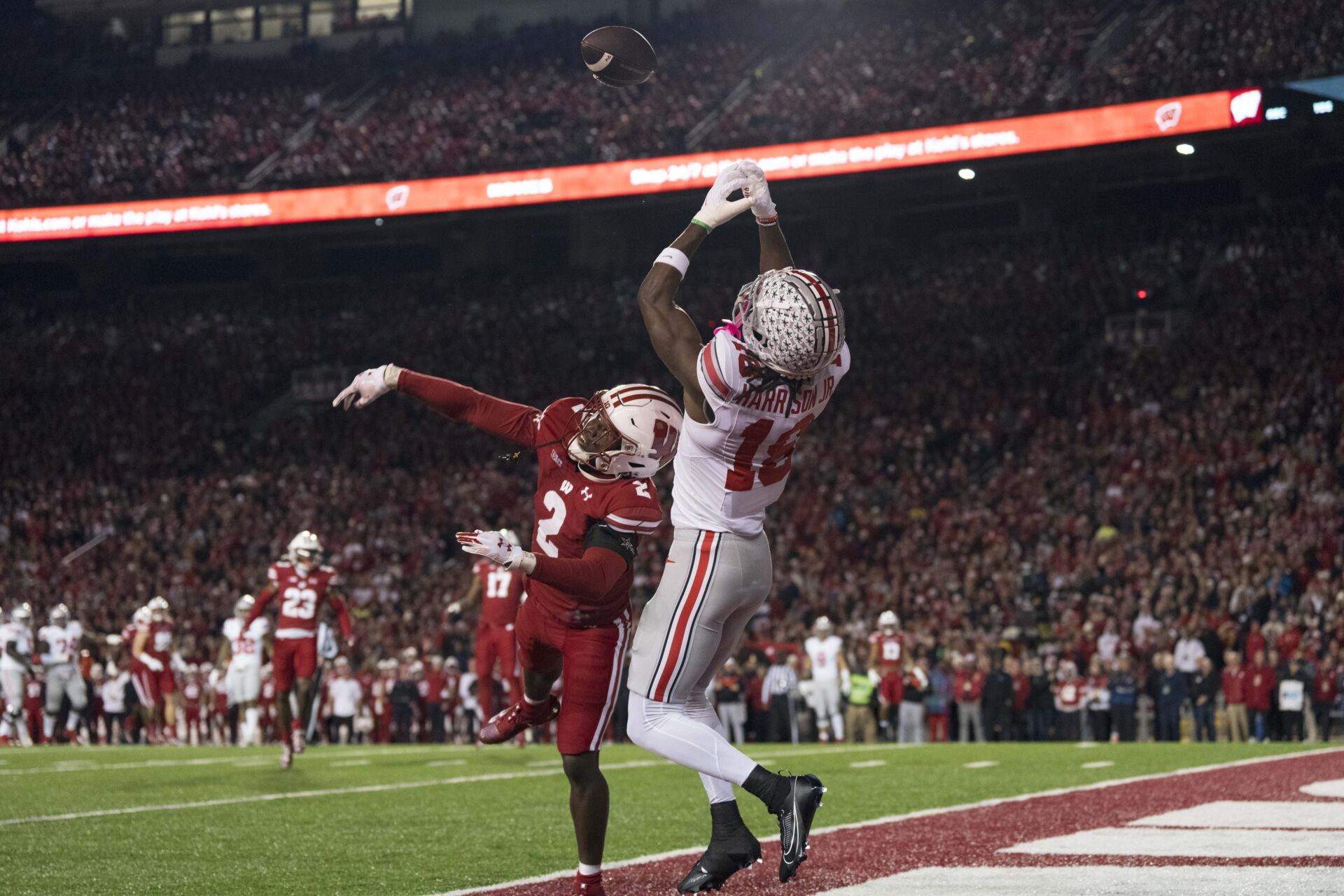 Wisconsin Badgers cornerback Ricardo Hallman (2) defends the pass intended for Ohio State Buckeyes wide receiver Marvin Harrison Jr. (18) during the first quarter at Camp Randall Stadium.