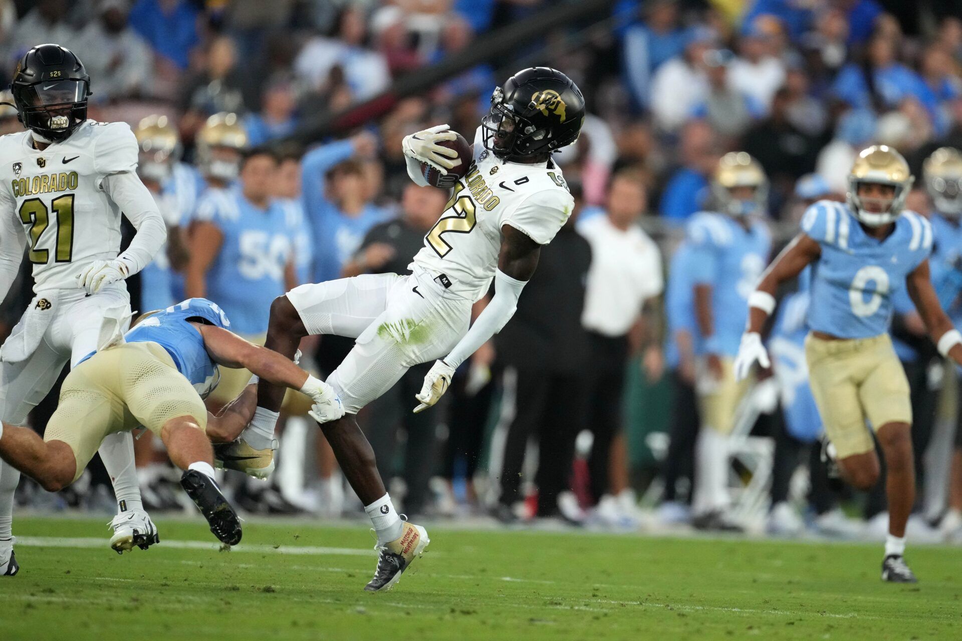 Colorado Buffaloes cornerback Travis Hunter (12) intercepts a pass against the UCLA Bruins in the first half at Rose Bowl.