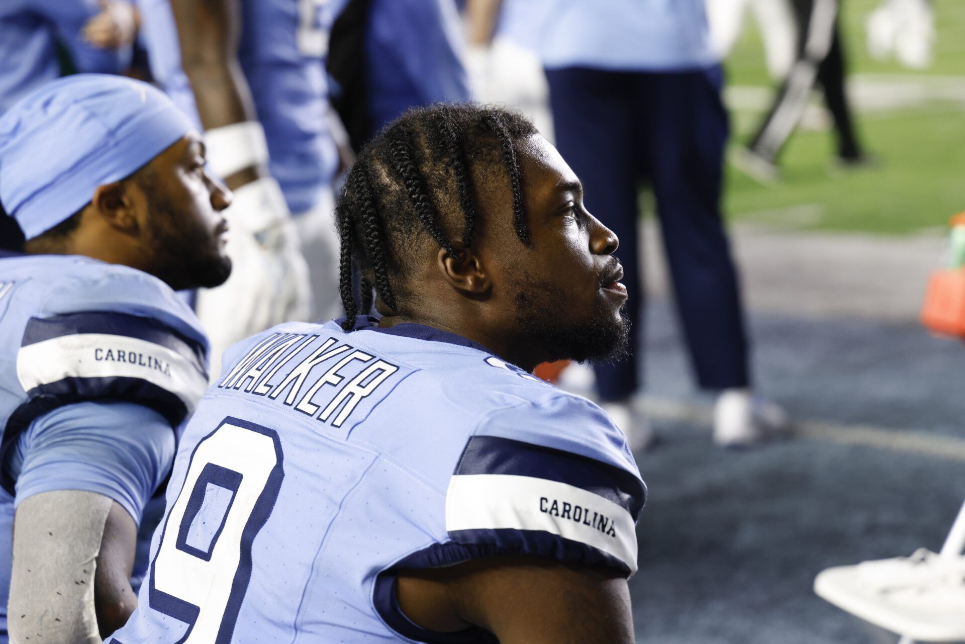 North Carolina Tar Heels wide receiver Devontez Walker (9) sits on the bench in the closing seconds of the game against the Miami Hurricanes at Kenan Memorial Stadium.