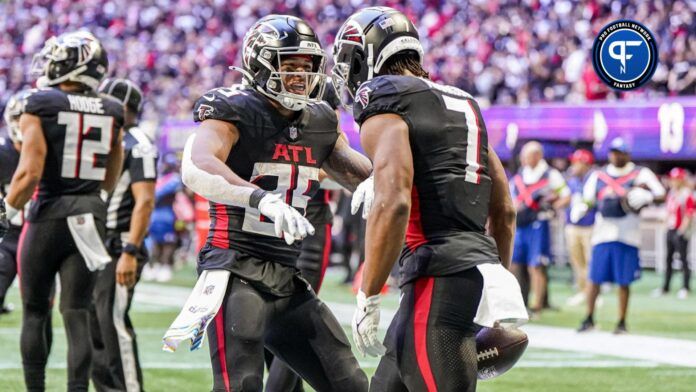 Atlanta Falcons running back Bijan Robinson (7) reacts with running back Tyler Allgeier (25) after scoring a touchdown against the Houston Texans during the second half at Mercedes-Benz Stadium.